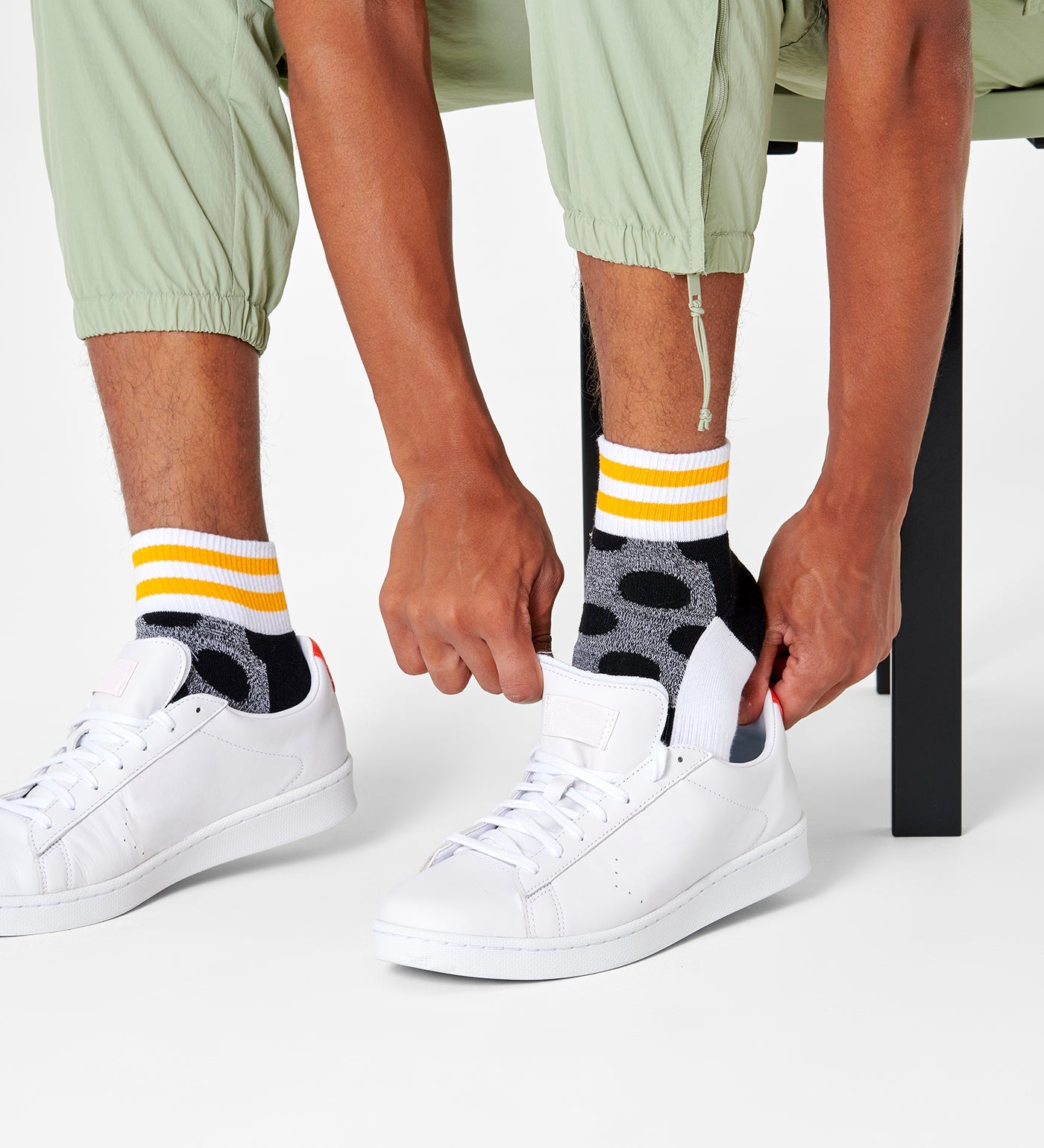 Bright, colorful unisex ankle socks featuring large dot patterns, suitable for both women and men.