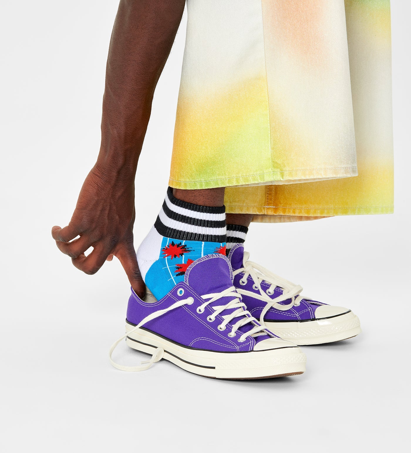 Bright, colorful explosion pattern on unisex ankle socks suitable for women and men. Stylish and comfortable footwear.