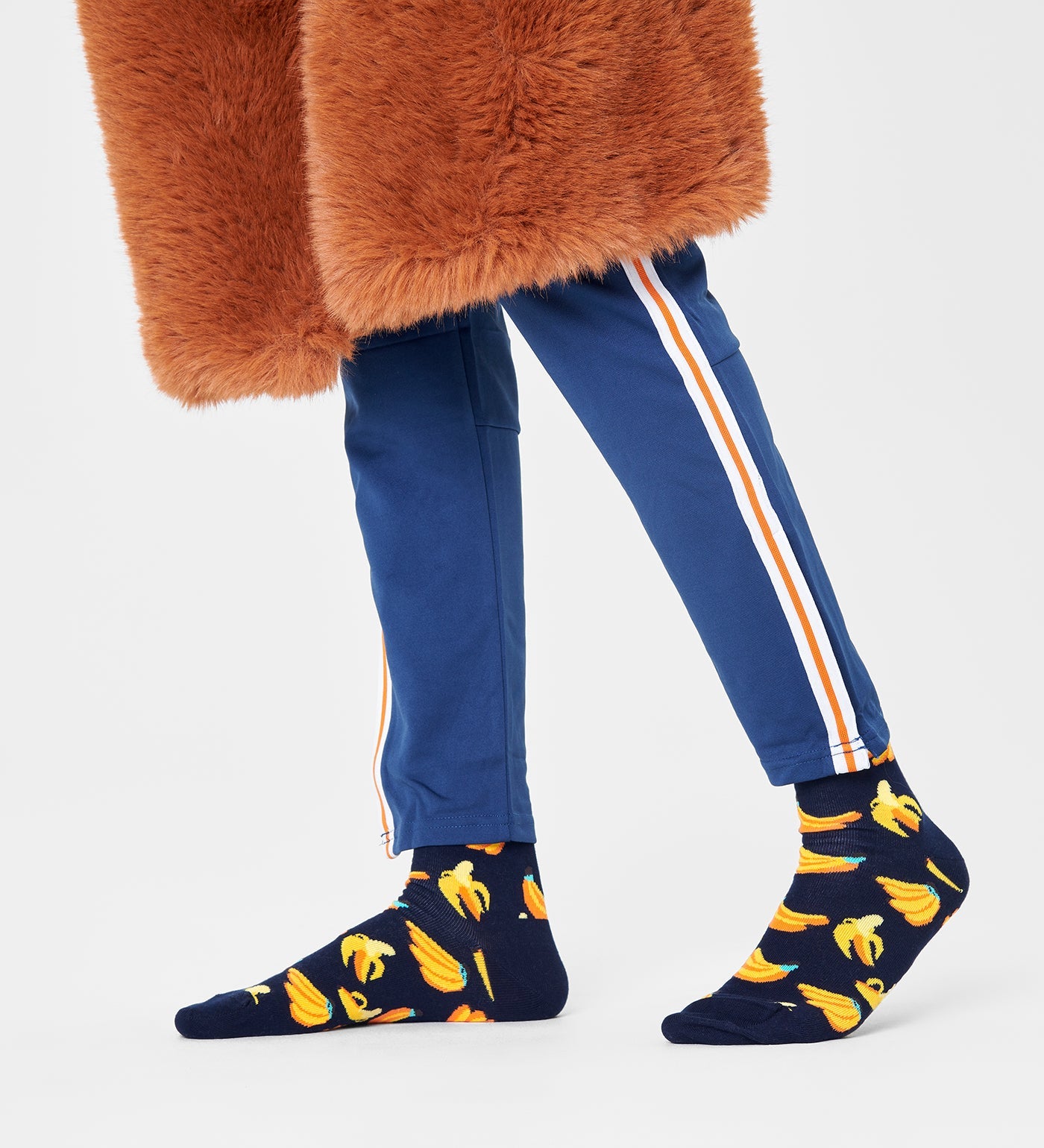 Bright yellow Happy Socks unisex banana crew socks featuring playful banana illustrations, suitable for women and men.