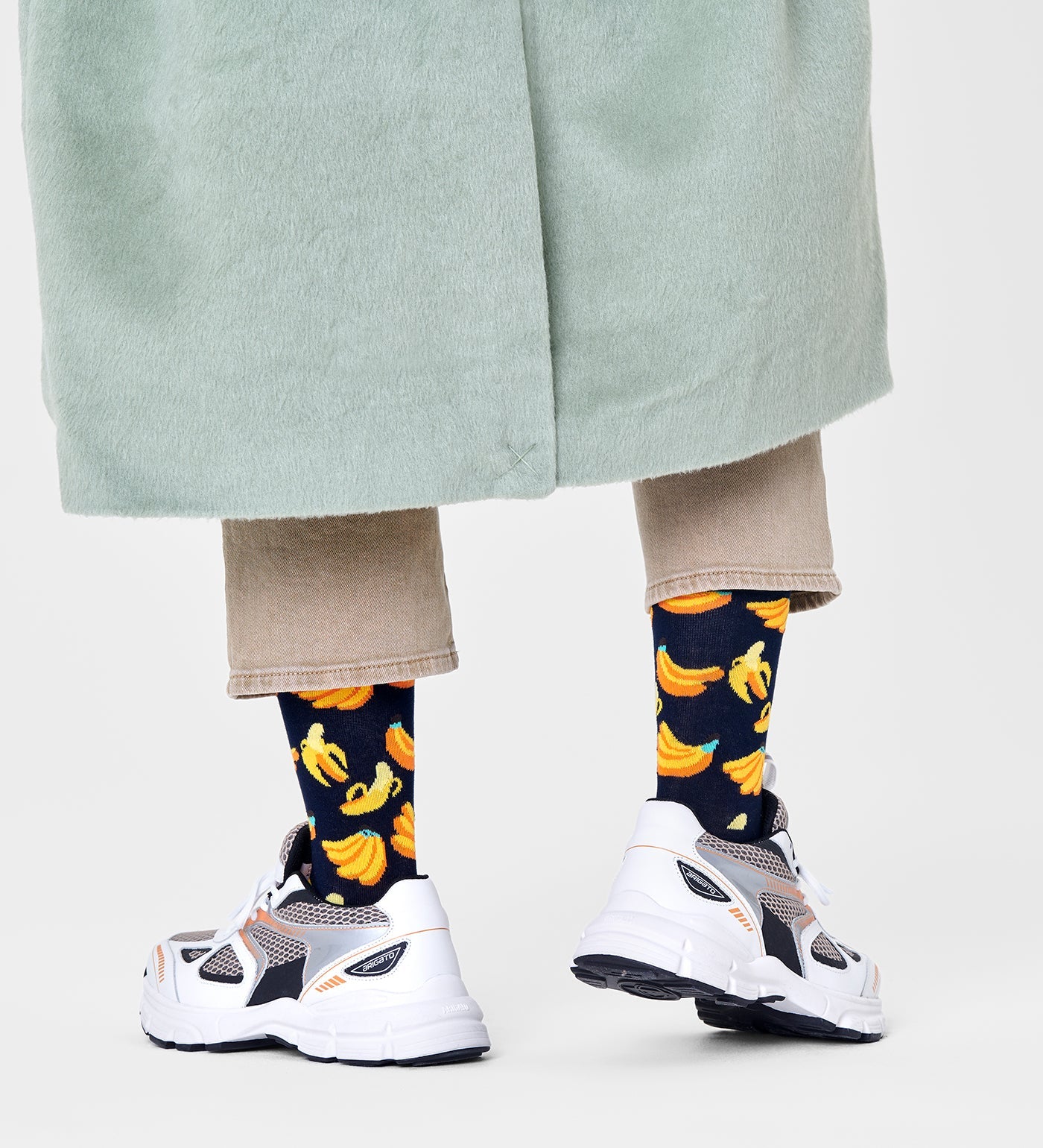 Bright yellow Happy Socks unisex banana crew socks featuring playful banana illustrations, suitable for women and men.