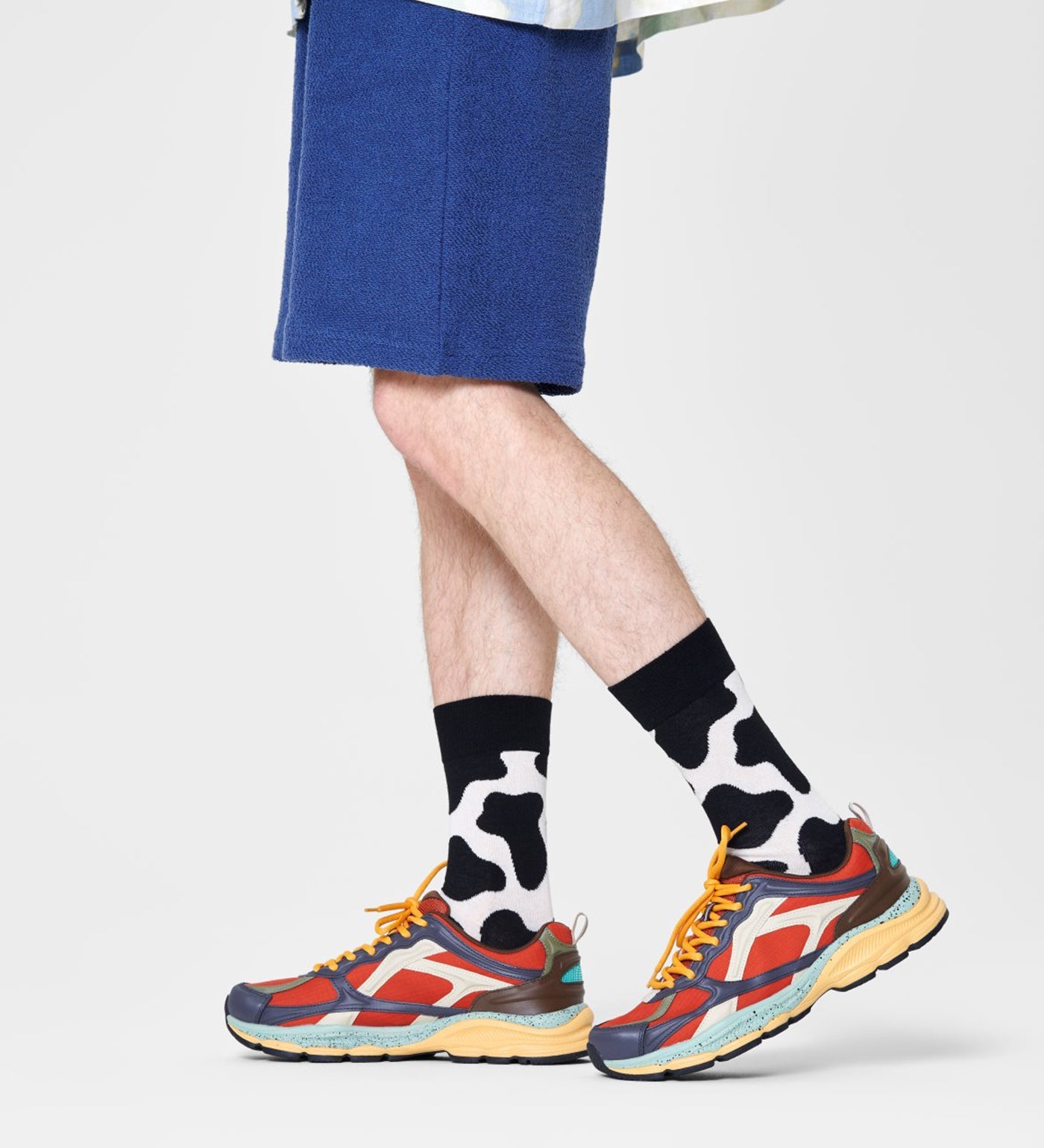 Colorful cow-patterned crew socks for women and men, playful unisex design, comfortable fit, and fun style.