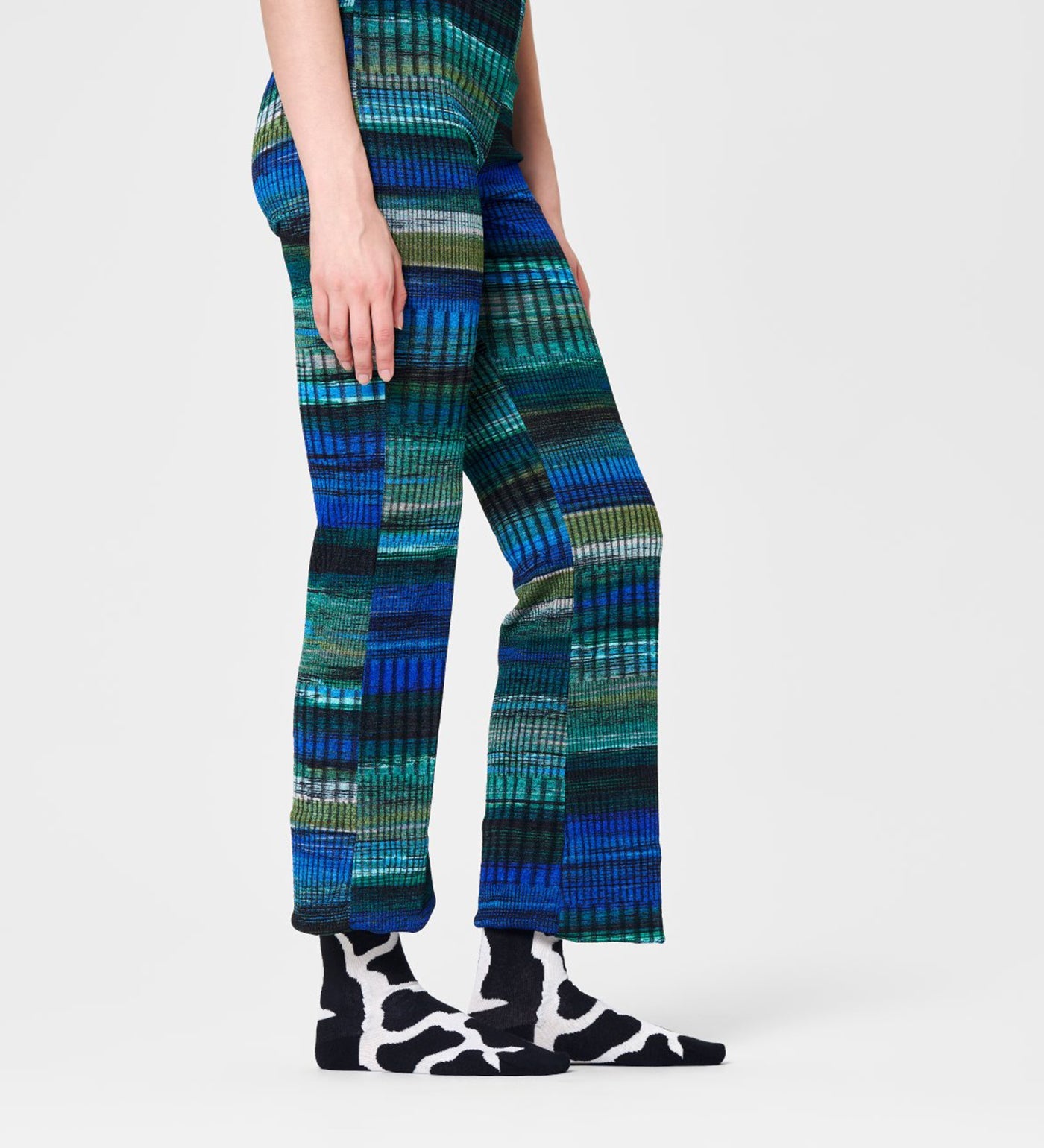 Colorful cow-patterned crew socks for women and men, playful unisex design, comfortable fit, and fun style.