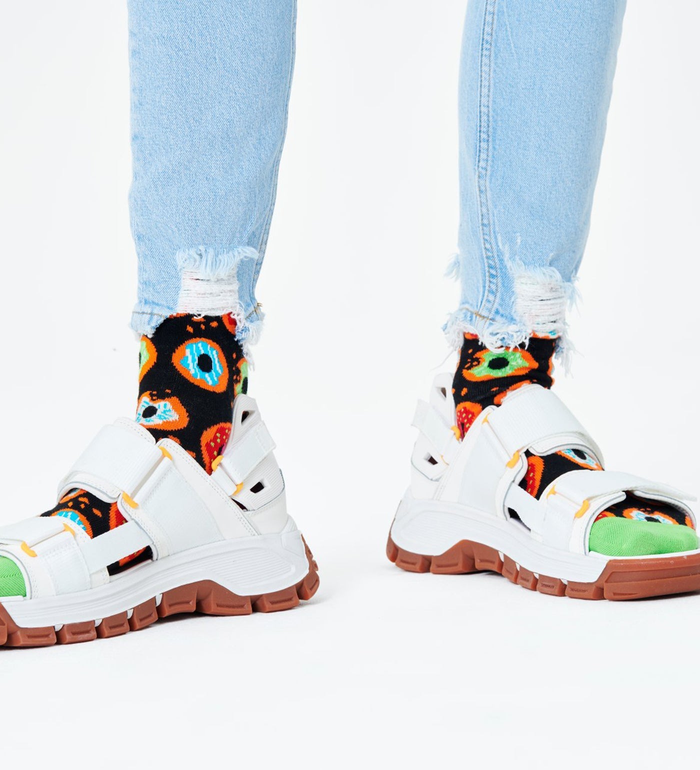 Bright, colorful donut pattern on unisex crew socks for women and men, fun and comfy accessory for any outfit.