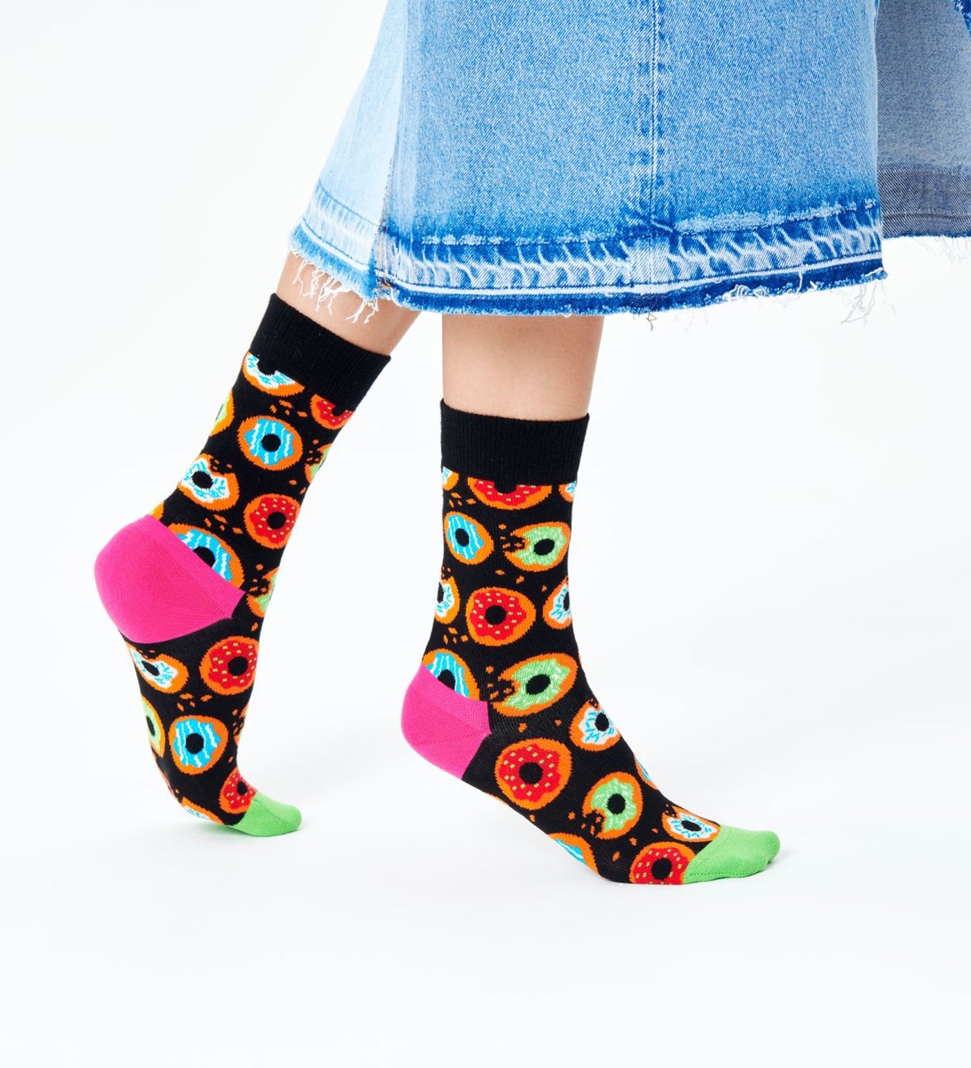 Bright, colorful donut pattern on unisex crew socks for women and men, fun and comfy accessory for any outfit.