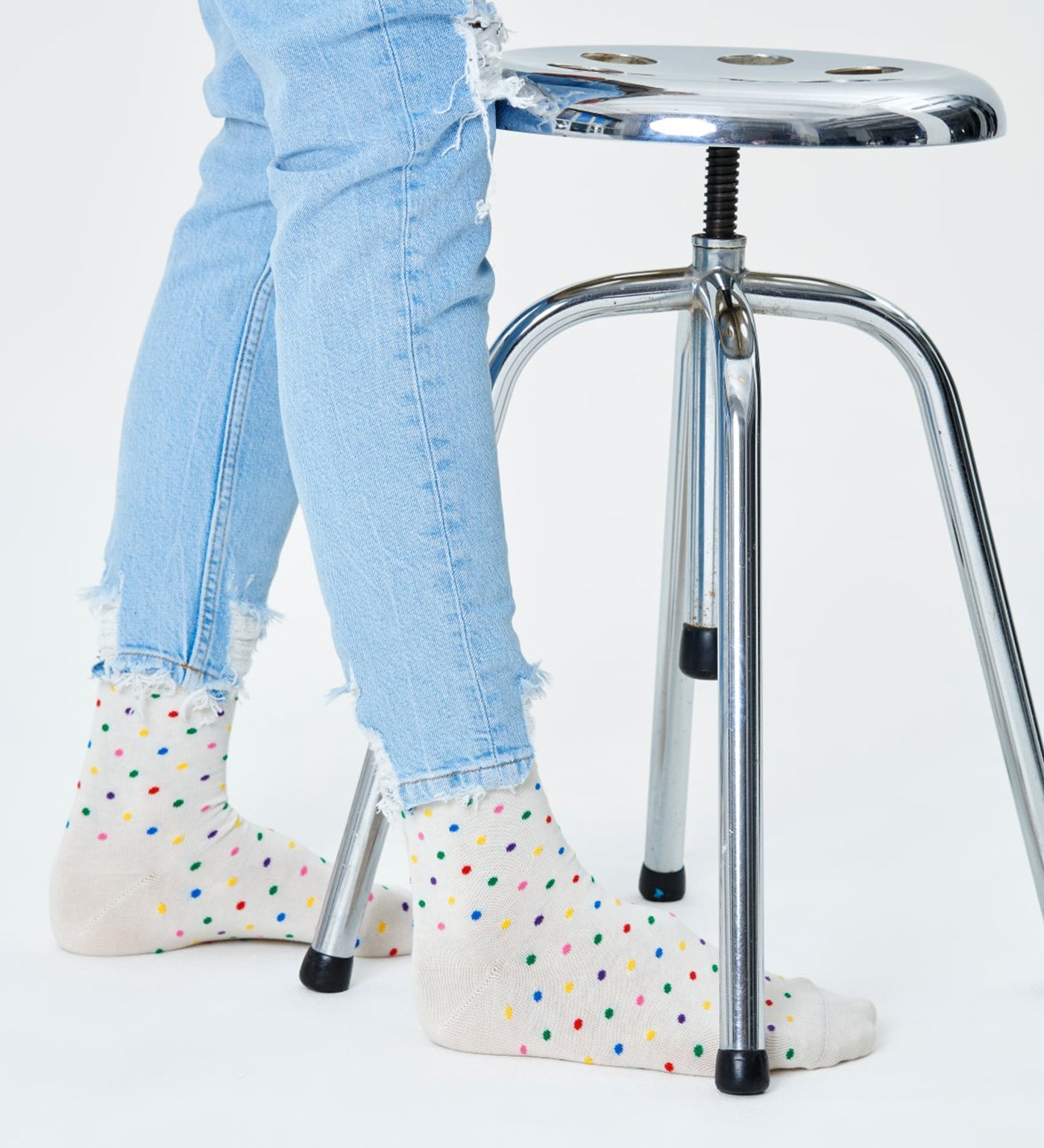 Bright, colorful dot pattern on calf-length unisex socks suitable for women and men. Stylish, fun, and comfortable wear.