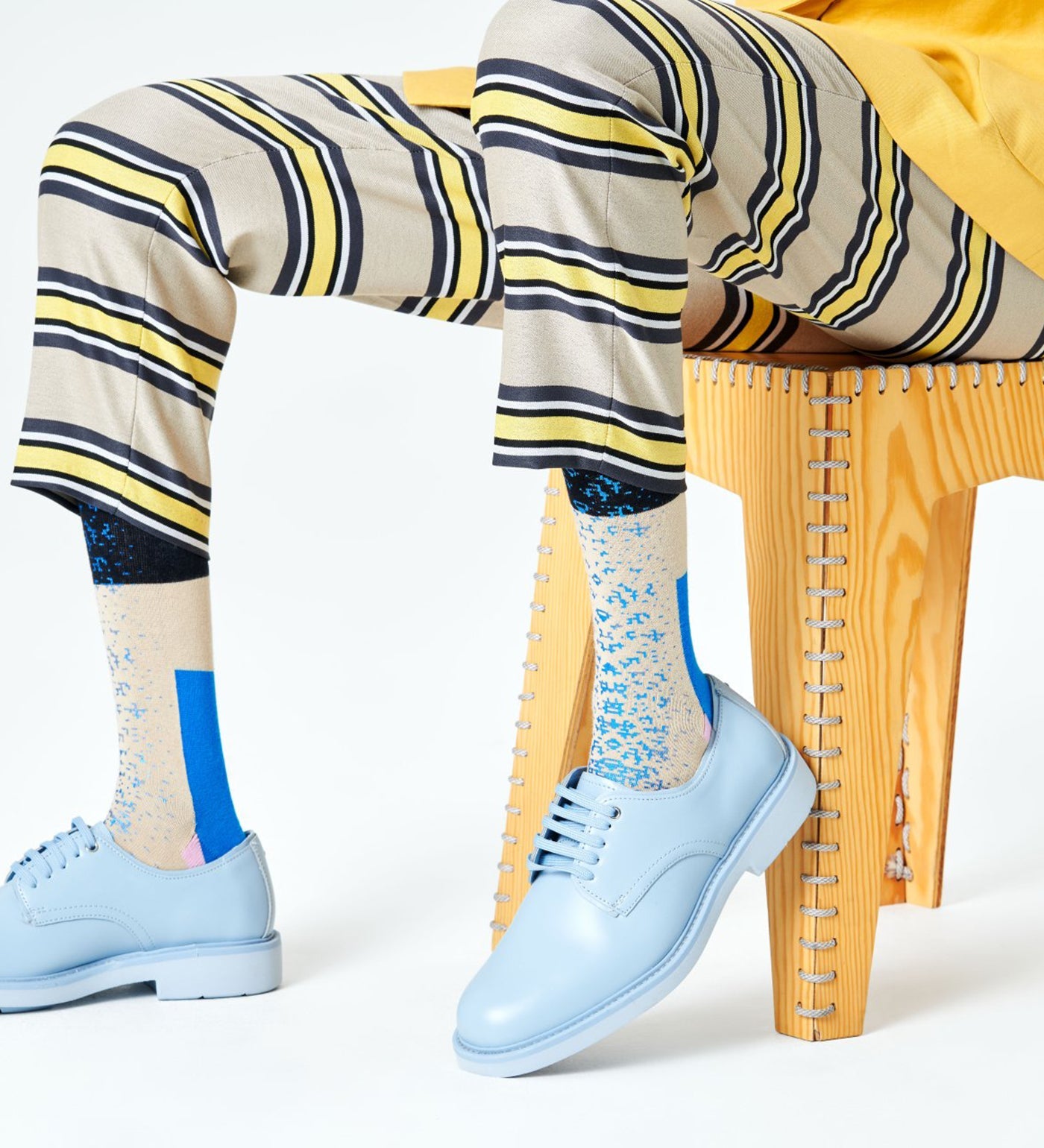 Alt text: Brightly colored Happy Socks Dressed Blocked Crew Socks for Men featuring bold geometric patterns and a comfortable crew length.