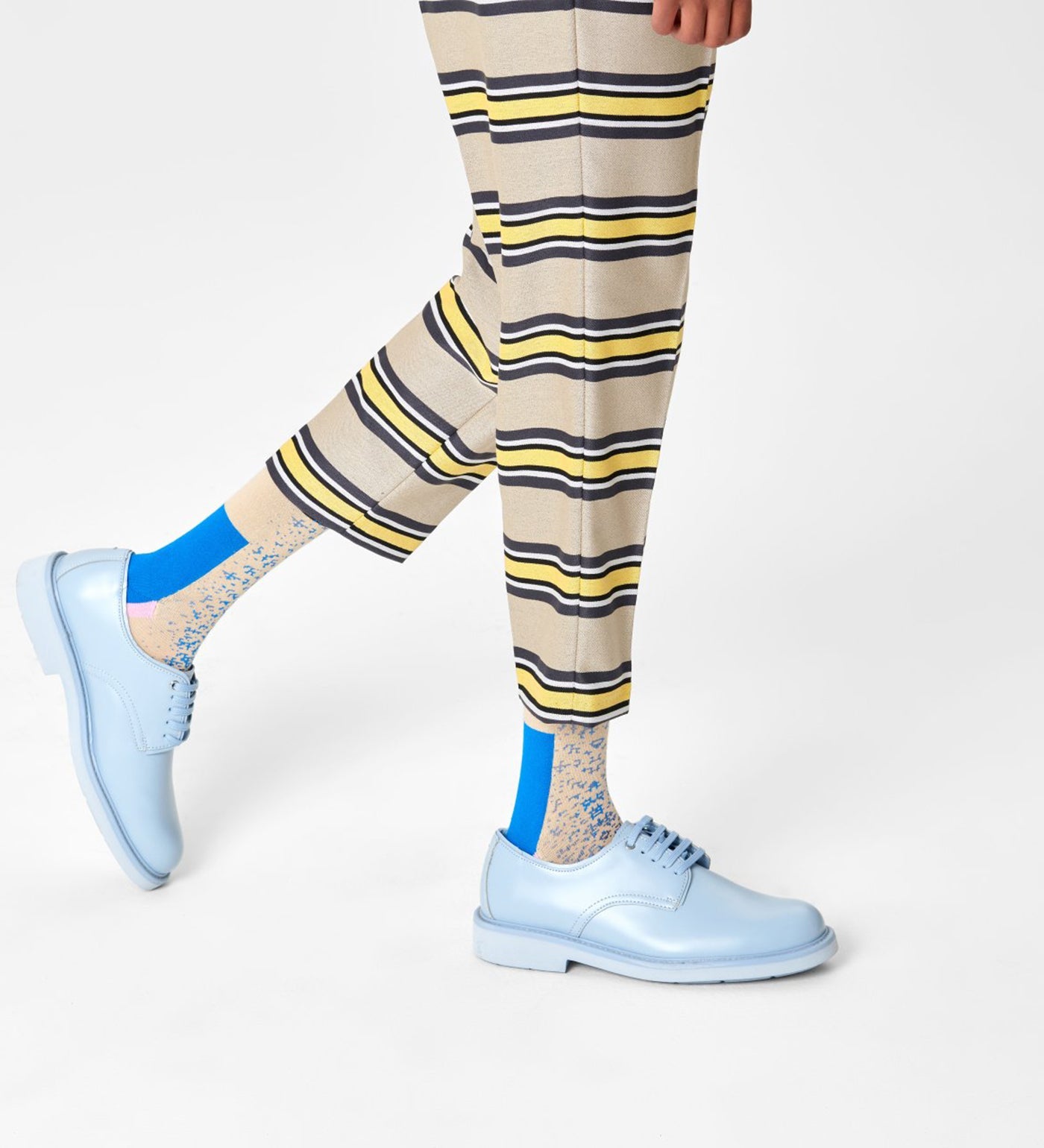 Alt text: Brightly colored Happy Socks Dressed Blocked Crew Socks for Men featuring bold geometric patterns and a comfortable crew length.