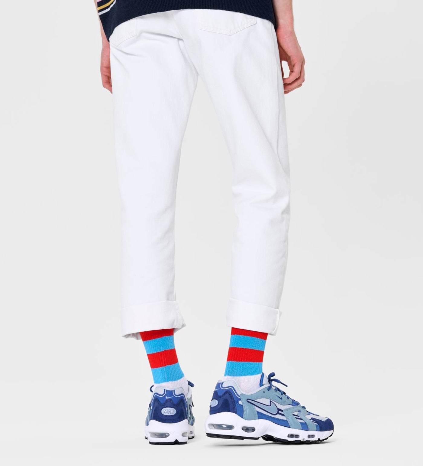 Bright, colorful unisex stripe calf-length socks by Happy Socks, suitable for women and men, featuring bold, playful patterns.