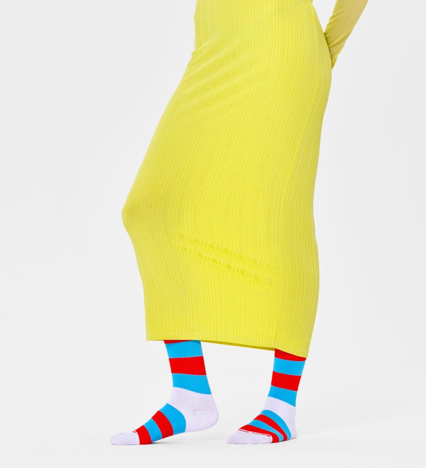 Bright, colorful unisex stripe calf-length socks by Happy Socks, suitable for women and men, featuring bold, playful patterns.