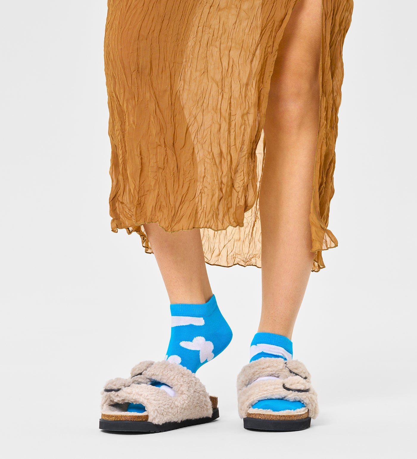 Colorful ankle length socks with a cloudy pattern, suitable for all genders. Perfect for adding a fun touch to any outfit.