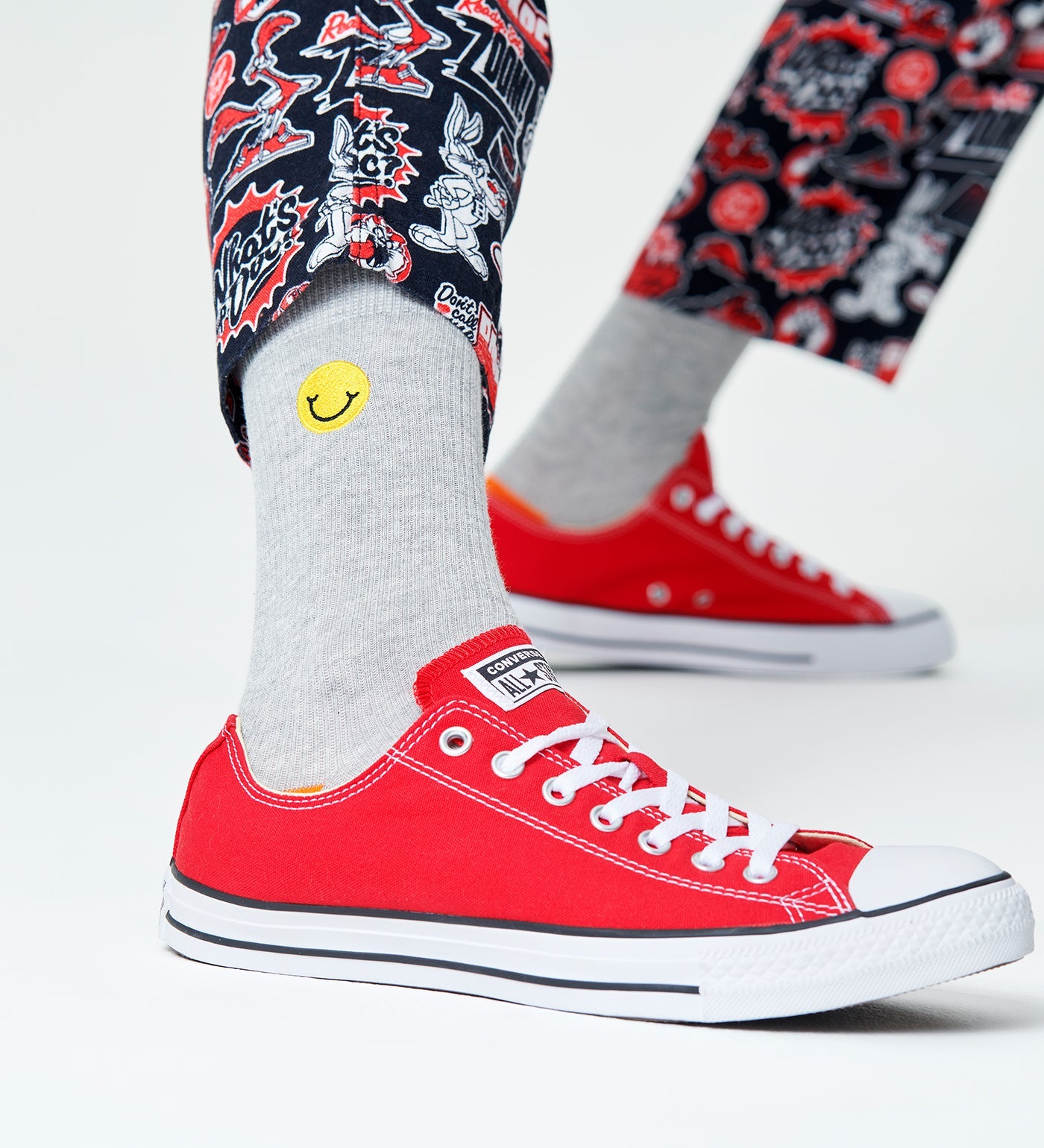 Bright yellow Happy Socks unisex crew socks featuring ribbed texture and embroidered smiley face design for women and men.