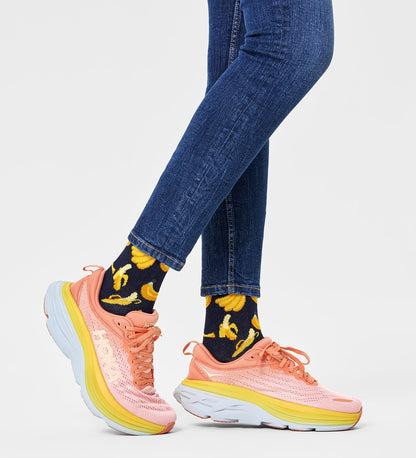 Bright yellow Happy Socks unisex banana crew socks featuring playful banana illustrations, suitable for women and men.