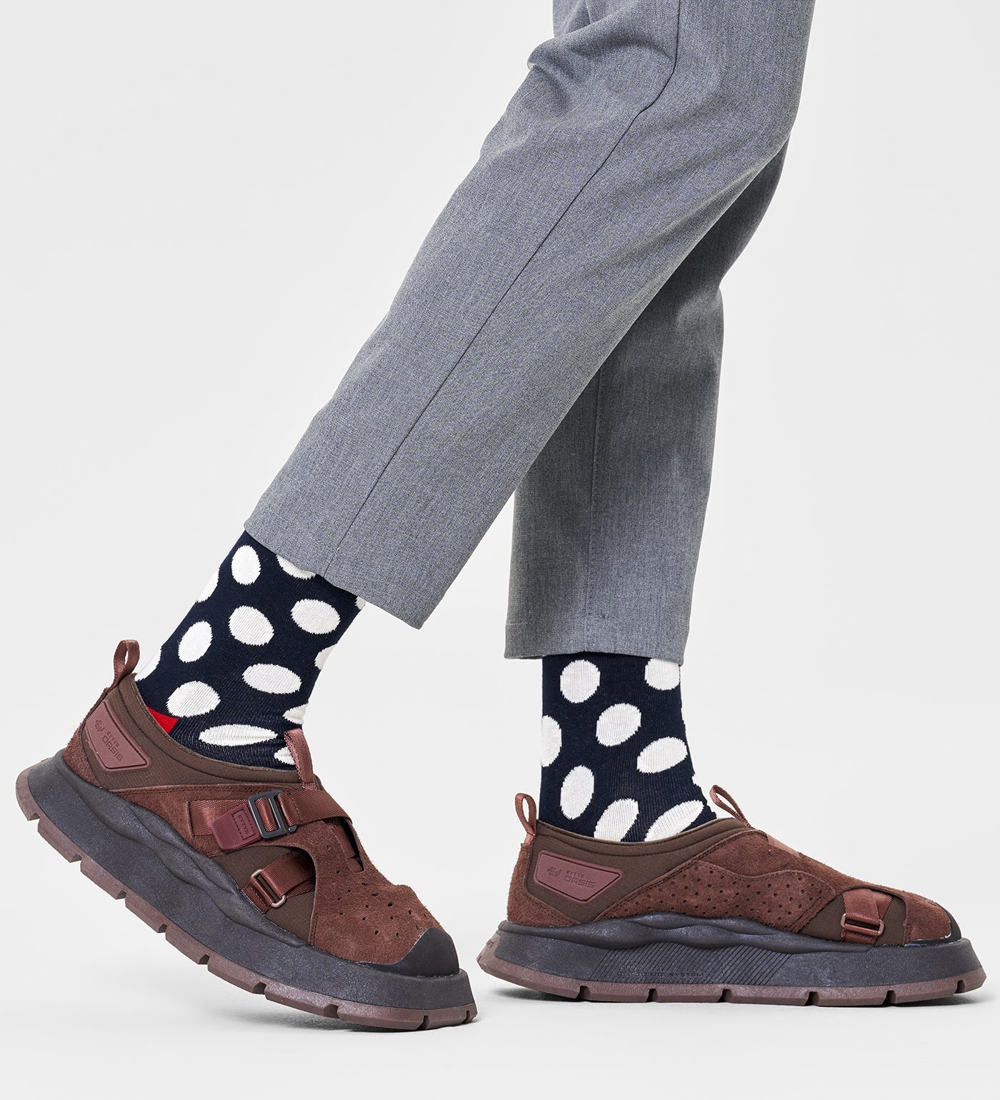 Colorful unisex crew socks featuring large dot patterns, suitable for women and men, by Happy Socks.