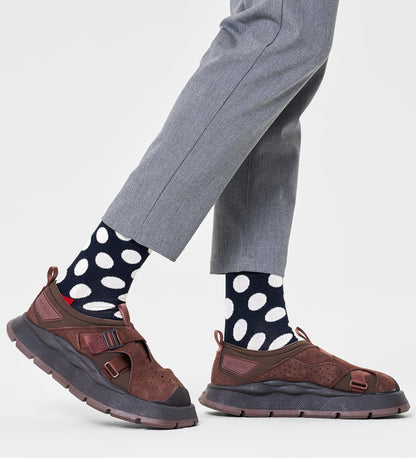 Colorful unisex crew socks featuring large dot patterns, suitable for women and men, by Happy Socks.