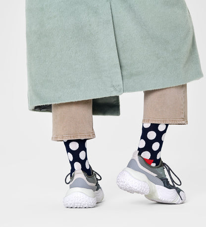 Colorful unisex crew socks featuring large dot patterns, suitable for women and men, by Happy Socks.