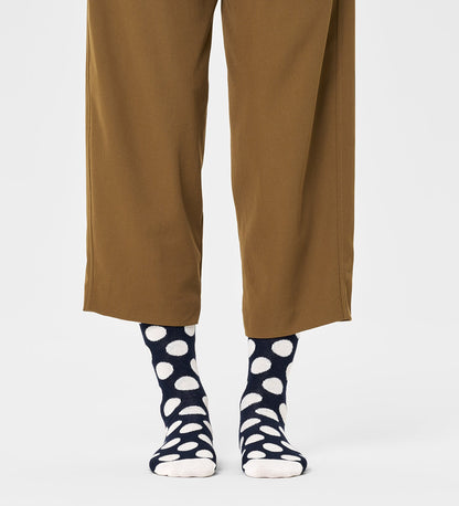 Colorful unisex crew socks featuring large dot patterns, suitable for women and men, by Happy Socks.