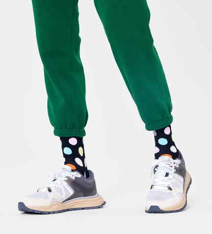 Colorful unisex crew socks featuring large dot patterns, suitable for women and men, by Happy Socks.