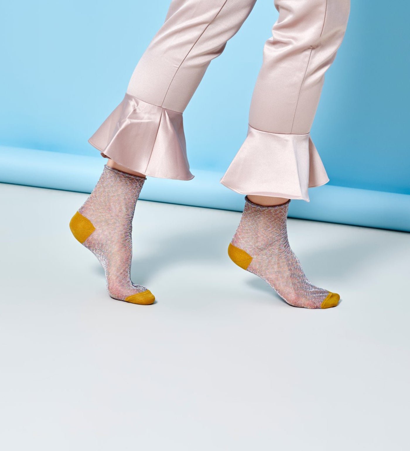 Brightly patterned Happy Socks Emma calf-length socks for women, offering vibrant style and comfortable fit for everyday wear.