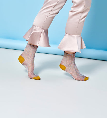 Brightly patterned Happy Socks Emma calf-length socks for women, offering vibrant style and comfortable fit for everyday wear.